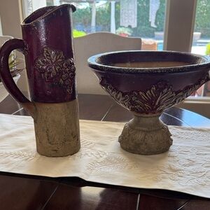 Decorative red and tan raised bowl and heavy pitcher